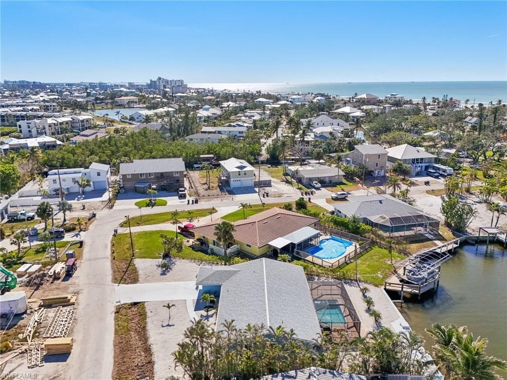 Aerial view of a nearby body of water and a pool