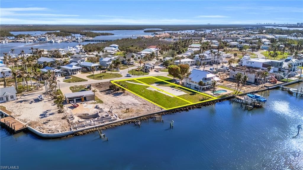Aerial perspective of suburban area featuring a large body of water - Virtually Edited Image