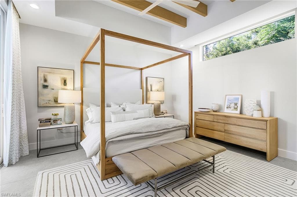 1st floor primary bedroom with sliders leading to pool.