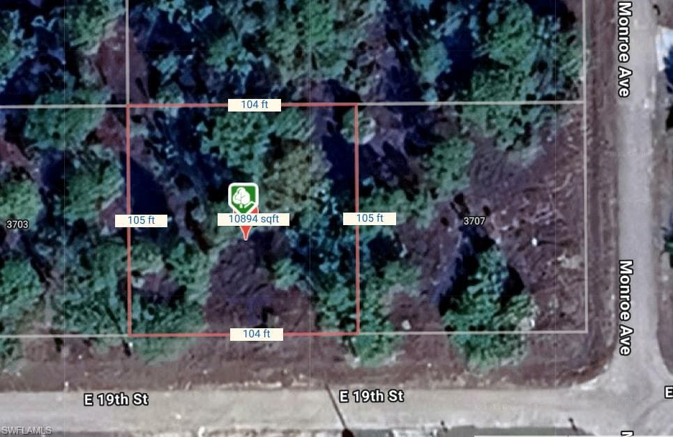Aerial overview of property's location featuring property parcel outlined