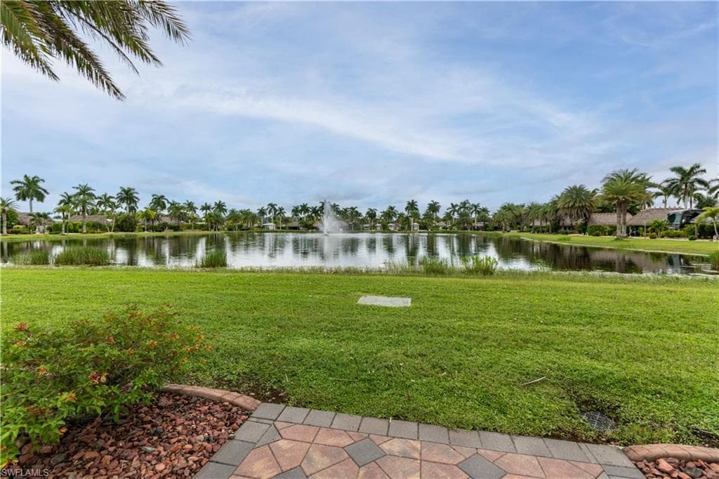 View of green lawn with a water view