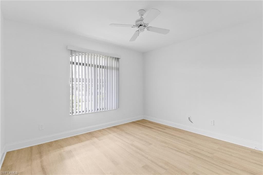 Spare room featuring light wood finished floors and a ceiling fan
