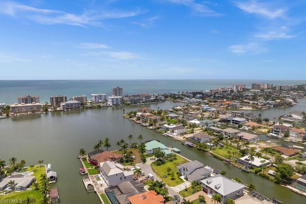 Aerial view of property with bay and gulf views