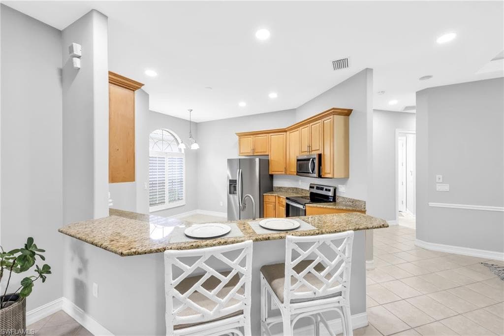 Breakfast peninsula overlooking kitchen, new stainless steel appliances, new cabinet hardware