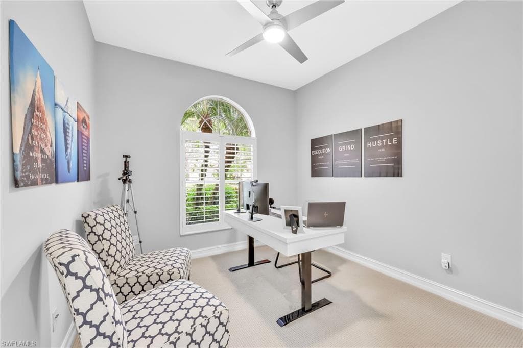 Bedroom #3 used as an Office featuring new carpet floors, fresh paint, ceiling fan, large closet