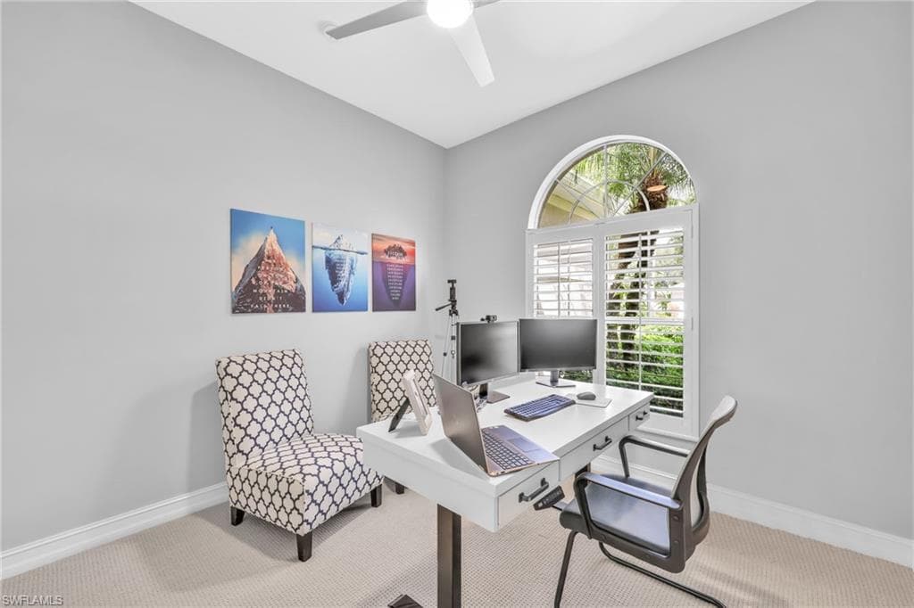 Bedroom #3 used as an Office featuring new carpet floors, fresh paint, ceiling fan, large closet