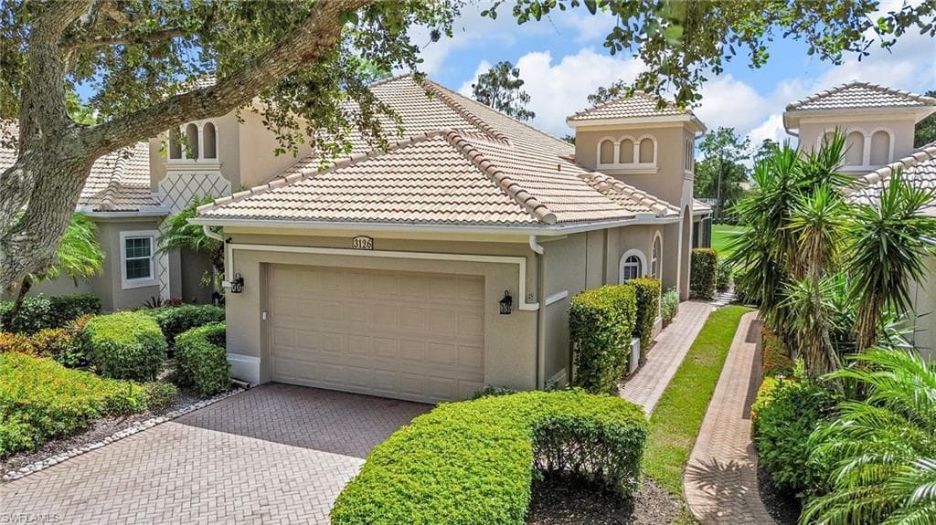 Mediterranean style home, 1 floor living, featuring freshly painted exterior, brick paver driveway, 2019 tile roof and a 2 car garage. This home is as clean as they come.