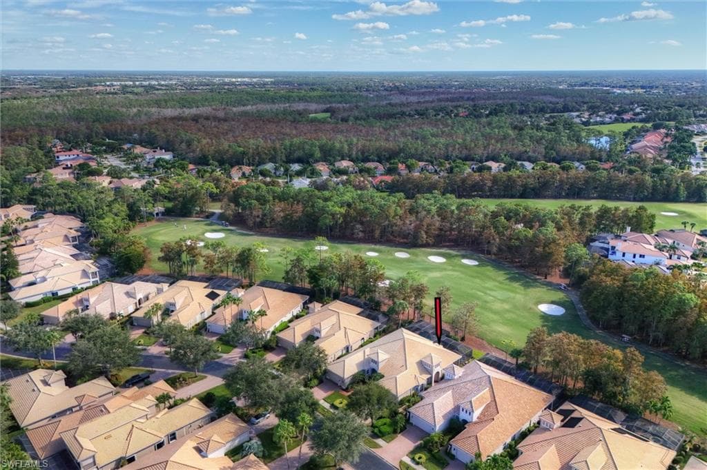 Aerial view of residential area with a golf club