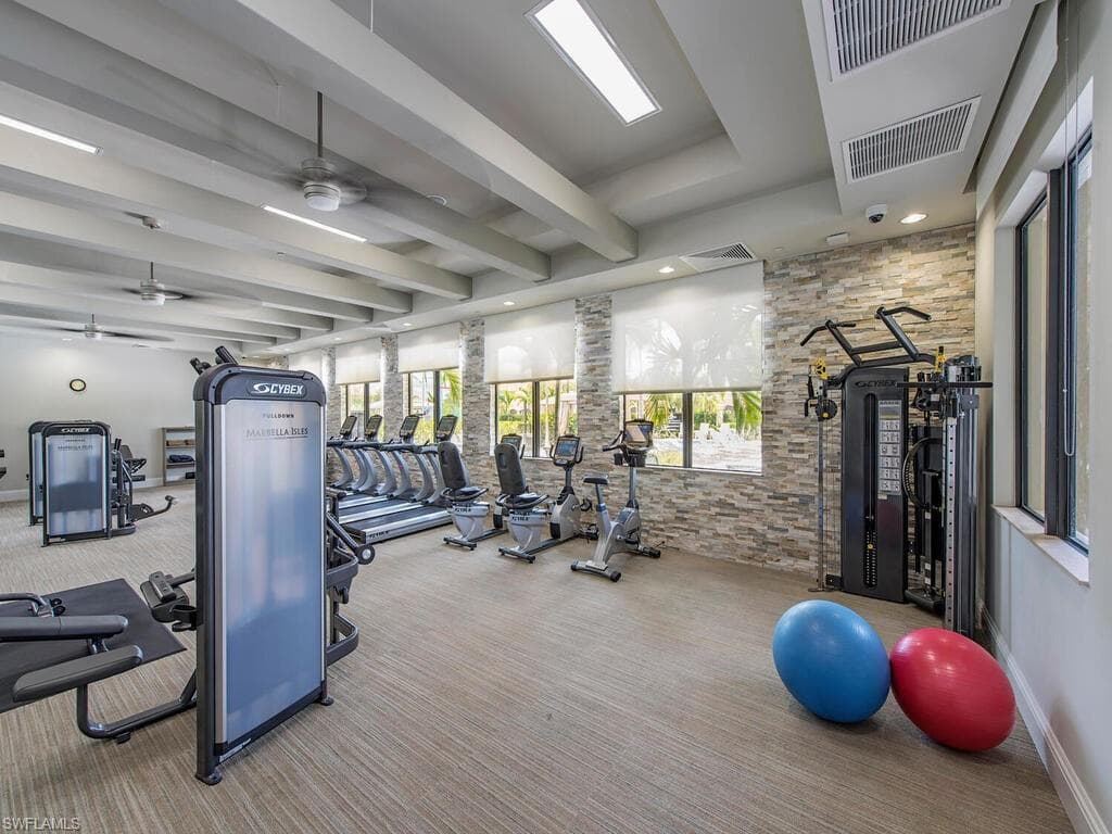 Workout area featuring carpet floors and ceiling fan