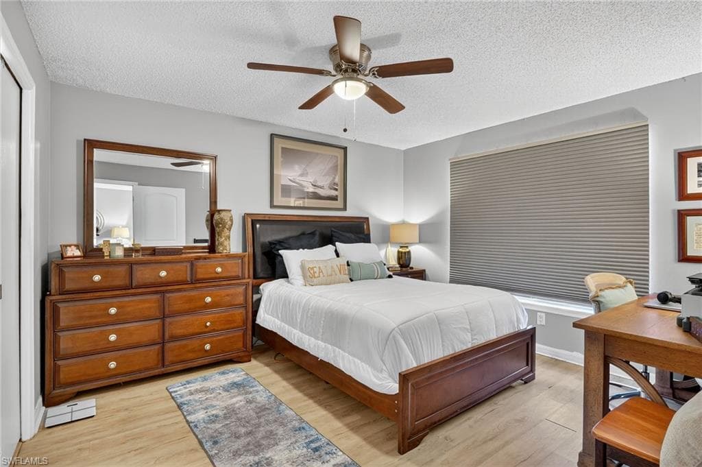 Bedroom with Hunter Douglas room darkening shade down.