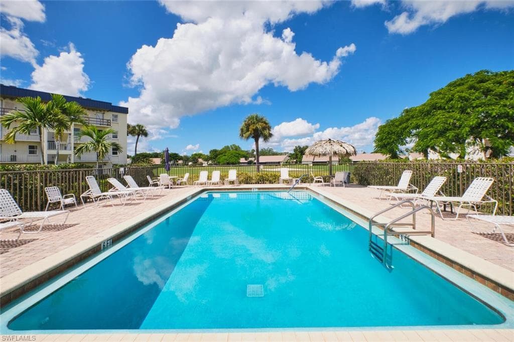 Community pool with a patio area
