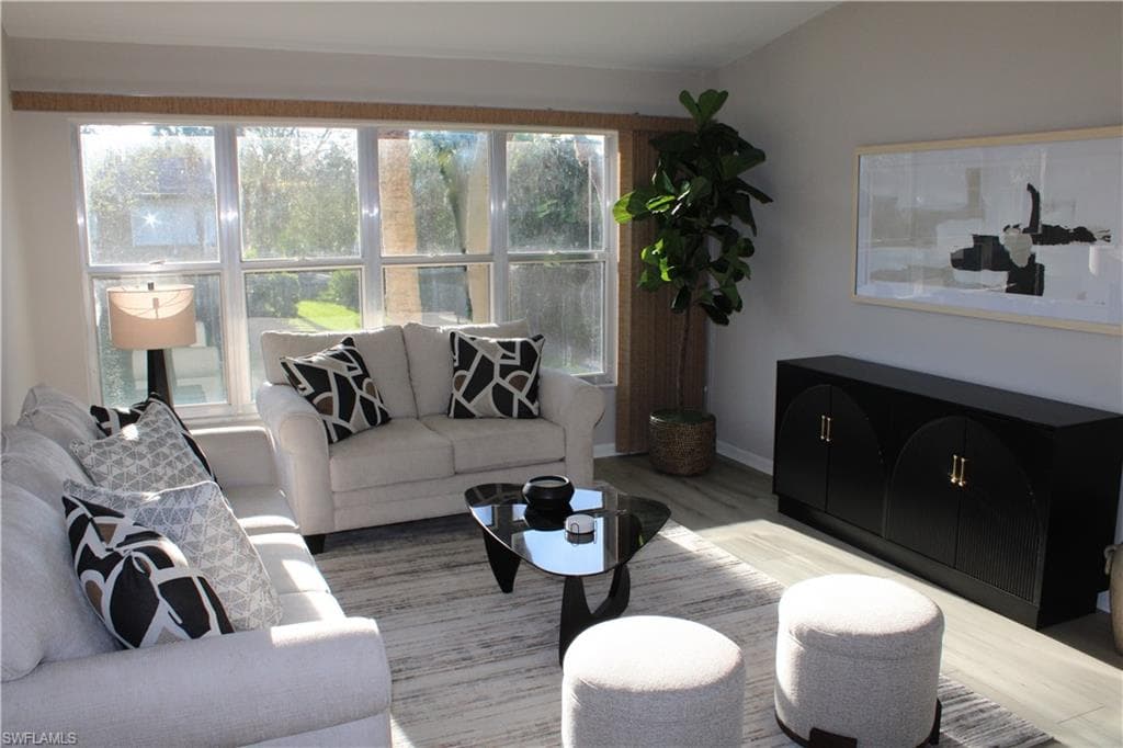 Living area featuring wood finished floors and baseboards