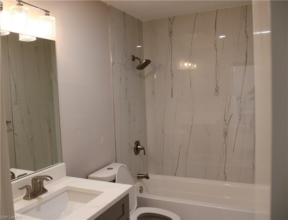 Full bath featuring bathing tub / shower combination and vanity