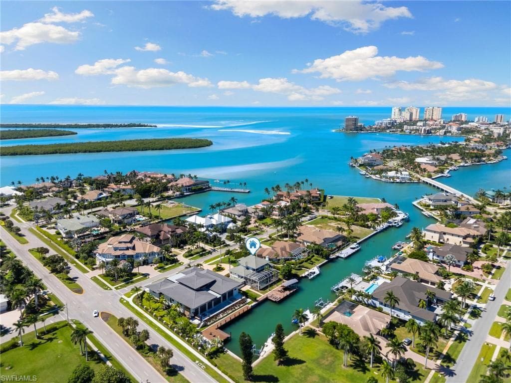 Aerial perspective of suburban area with a nearby body of water