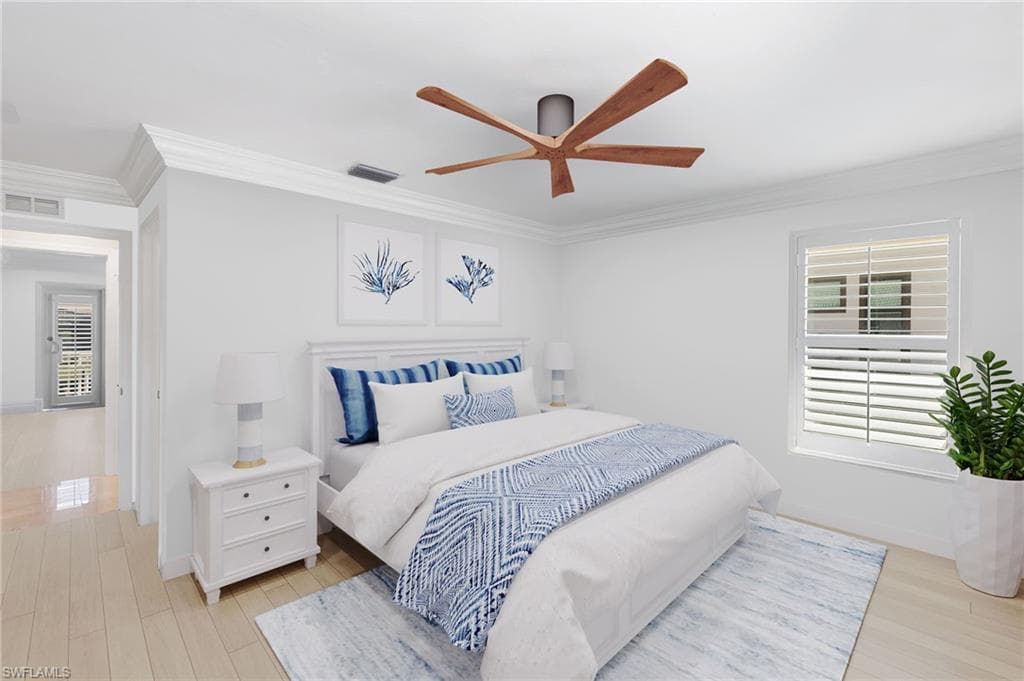 Virtually Staged - Bedroom with multiple windows, ornamental molding, light wood-style floors, and ceiling fan