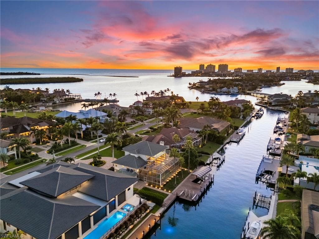 Aerial view of residential area featuring a large body of water