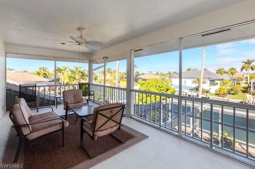 Sunroom featuring a residential view