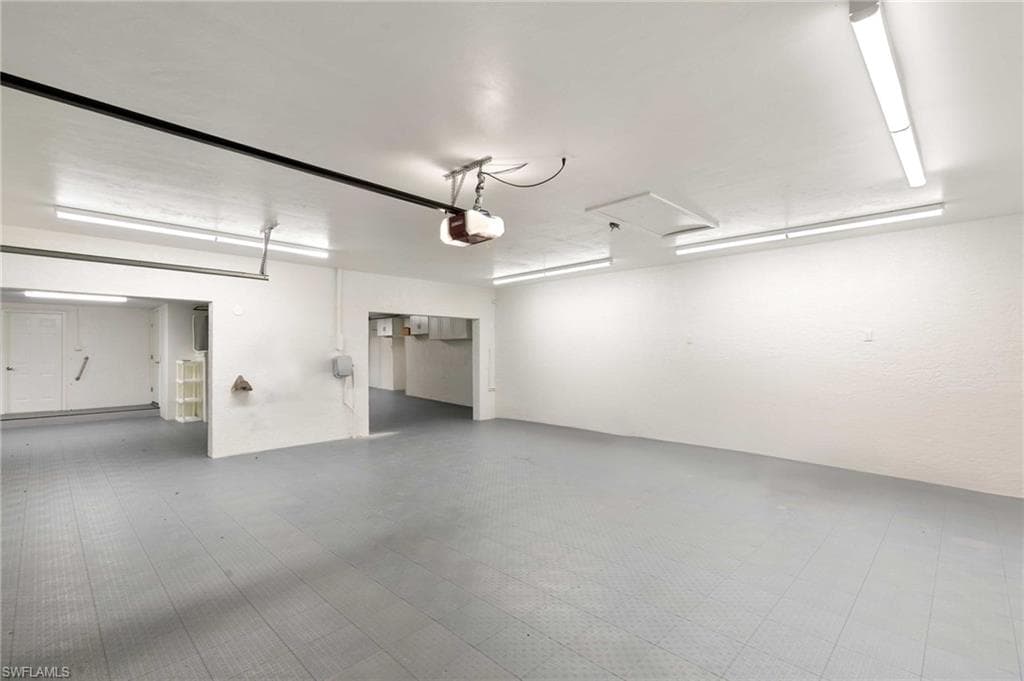 View of garage - 3 Stalls with space for 5+ Vehicles