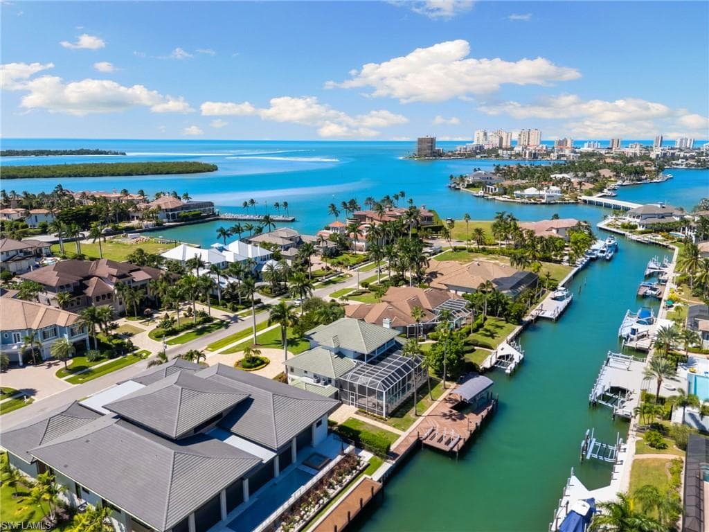 Aerial view of residential area with a large body of water