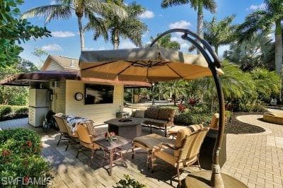 View of patio / terrace with an outdoor living space with a fire pit