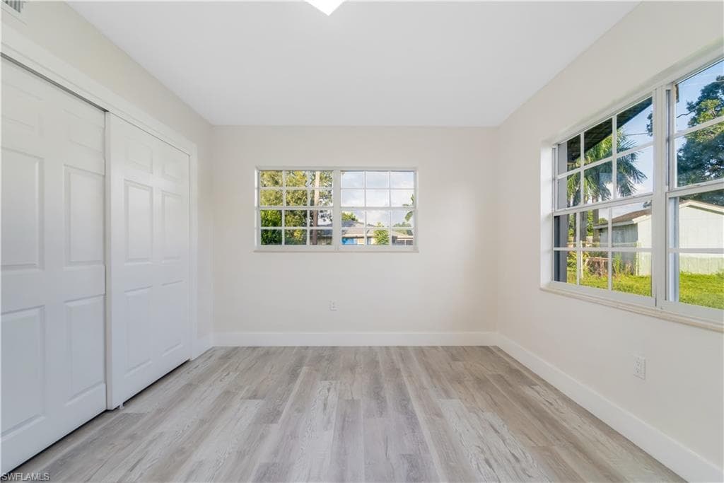 Full bath with vanity, bathing tub / shower combination, light wood-type flooring, and recessed lighting