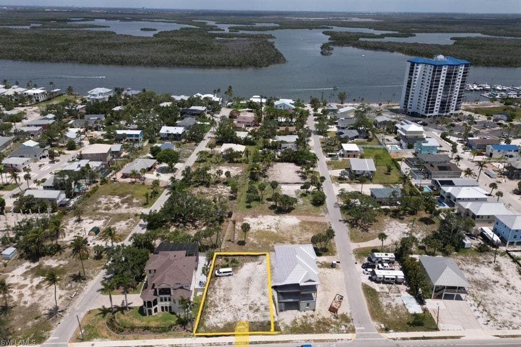 Aerial perspective looking East to intercoastal body of water and property parcel outlined