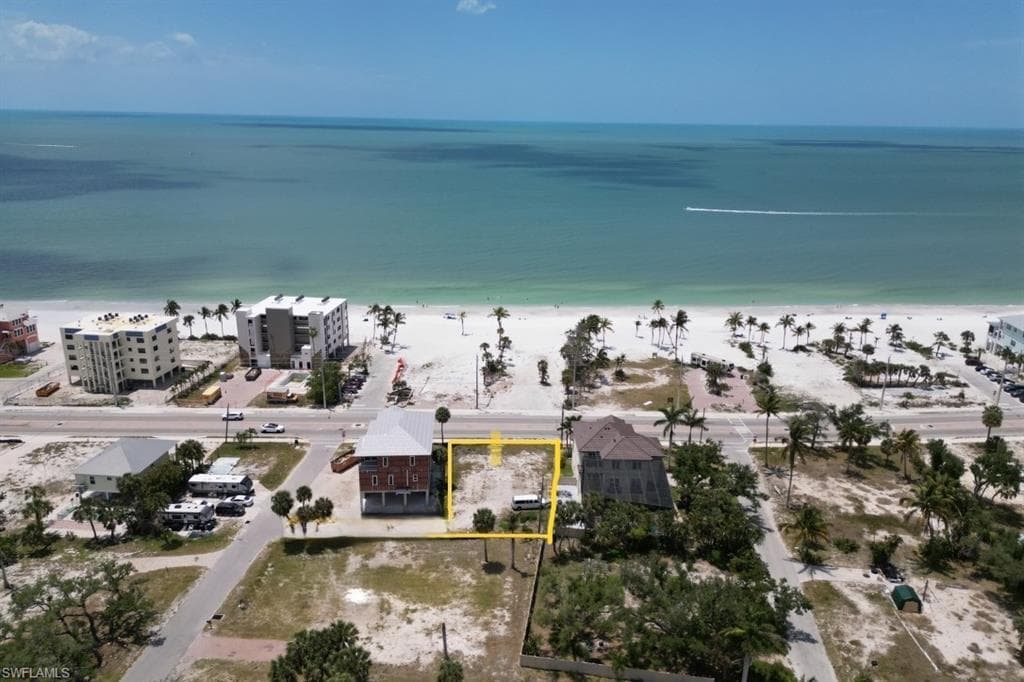 Aerial view of property's location with property parcel outlined and extended coastline