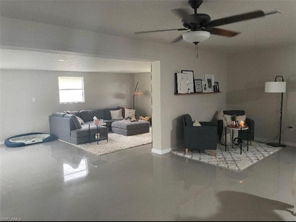 Living room featuring ceiling fan