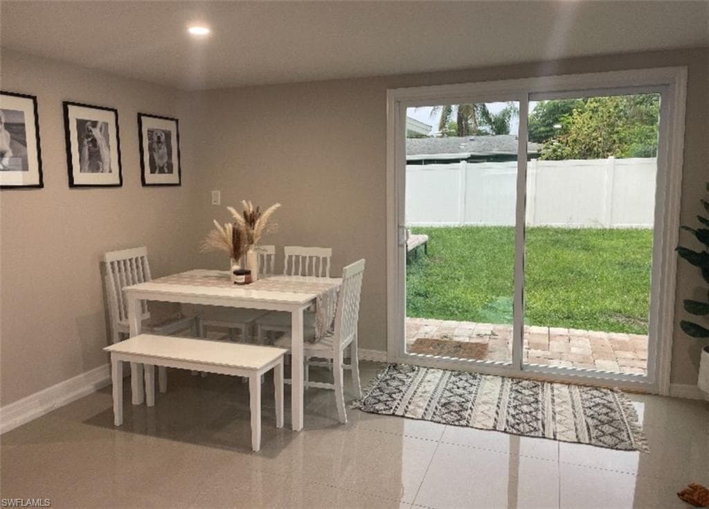 Dining room featuring light tile patterned floors