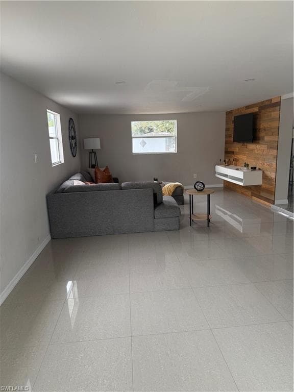Living room with wood walls