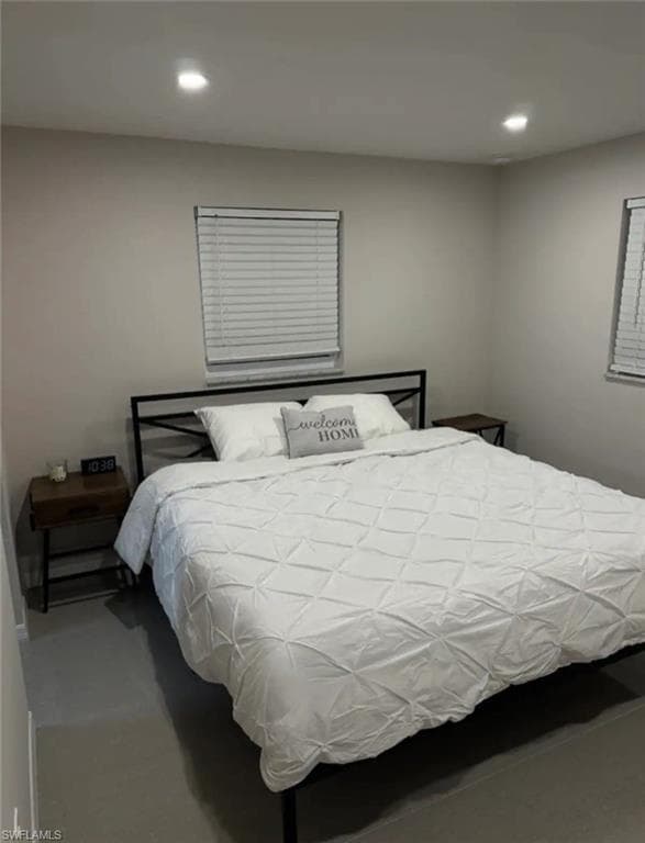 Bedroom with concrete flooring