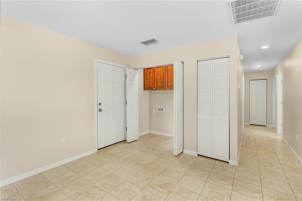 Spare room with recessed lighting and light tile patterned flooring