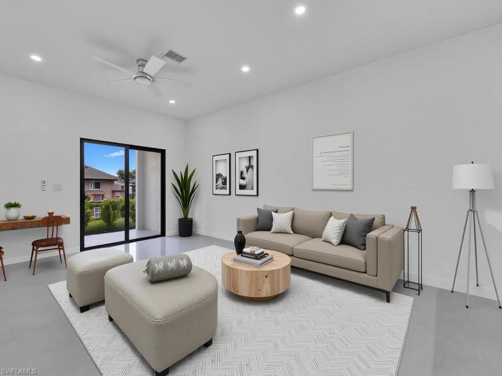 Living room featuring recessed lighting and a ceiling fan