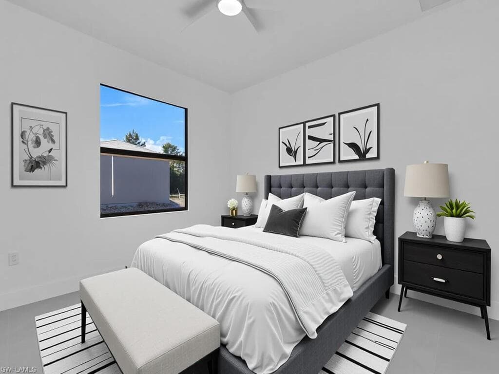 Tiled bedroom featuring baseboards and ceiling fan
