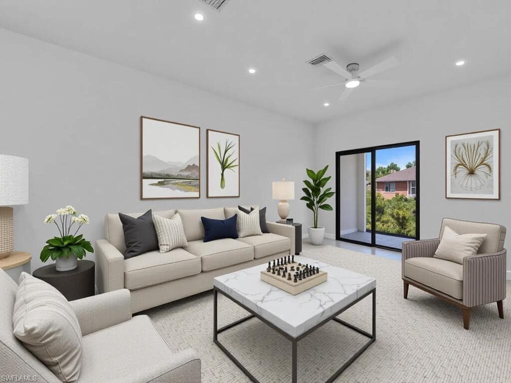 Carpeted living room featuring recessed lighting and ceiling fan
