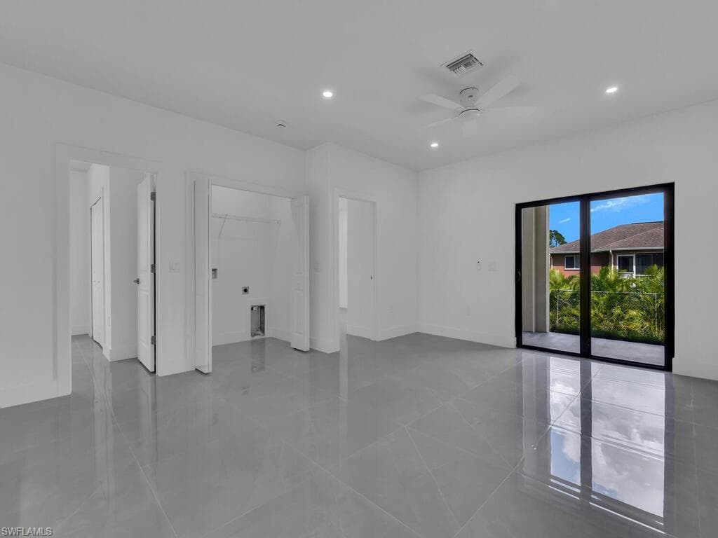Spare room featuring recessed lighting, ceiling fan, and light tile patterned floors