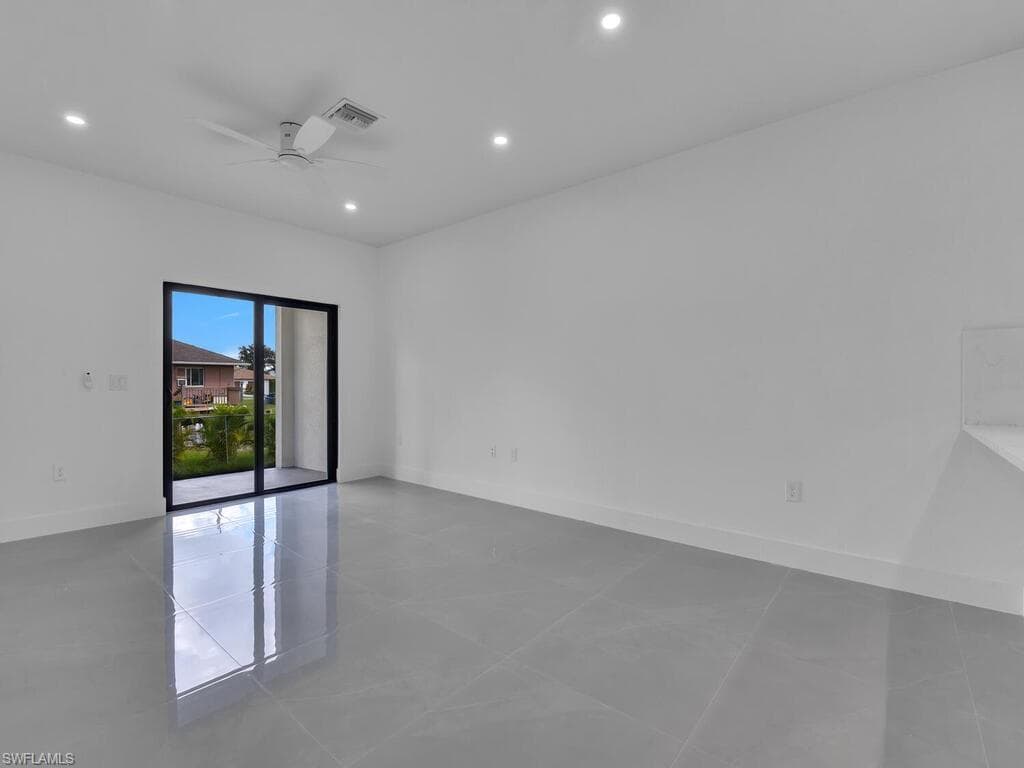 Unfurnished room featuring recessed lighting, a ceiling fan, and light tile patterned floors