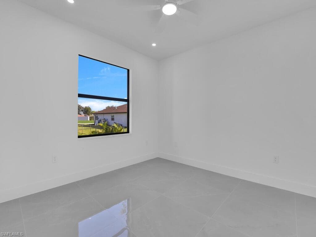 Spare room with recessed lighting and light tile patterned floors