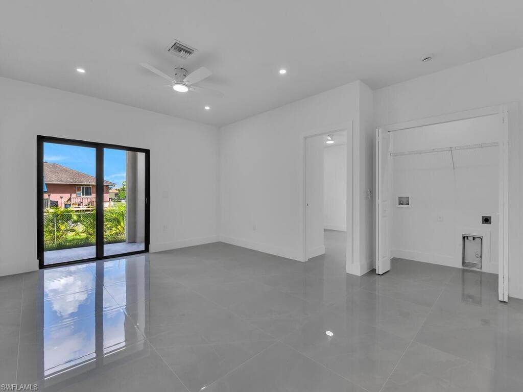 Spare room with recessed lighting, light tile patterned floors, and a ceiling fan