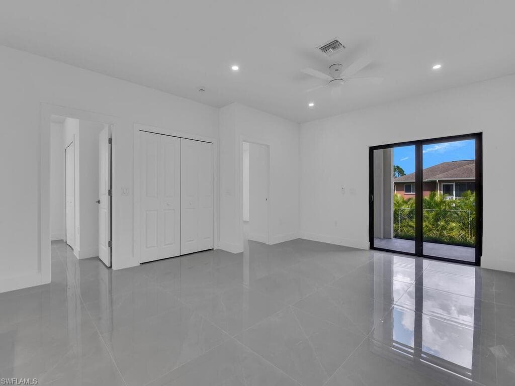Unfurnished bedroom with recessed lighting, access to outside, ceiling fan, a closet, and light tile patterned floors