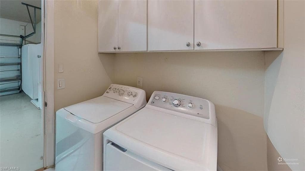 Laundry room with washing machine and dryer and cabinet space