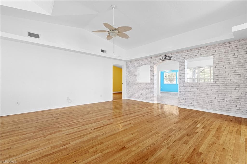 Looking from front of home towards second family room area and entry into primary bedroom.