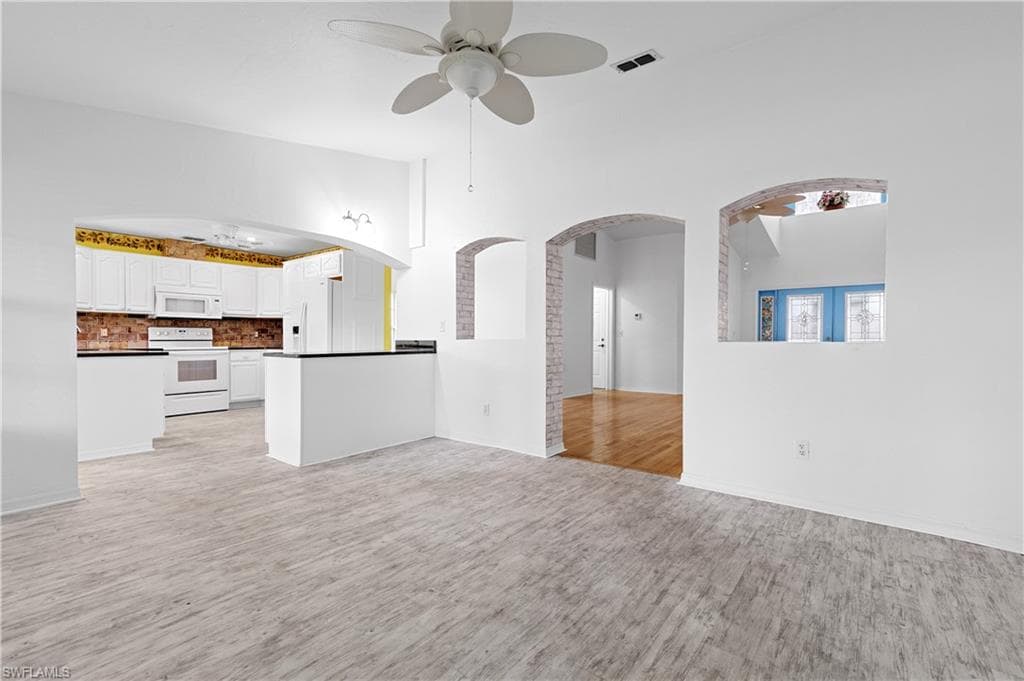 View from second living area / family room at kitchen and front great/family room and double door entrance.