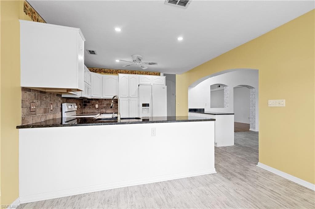 looking into kitchen from dining or sitting area.