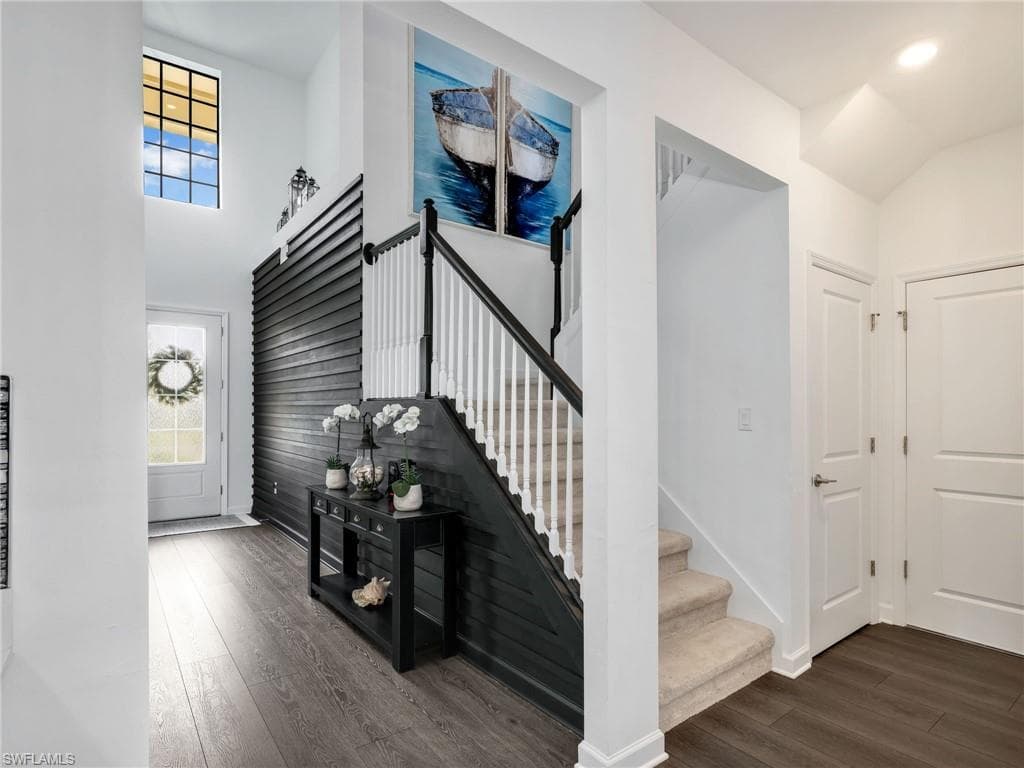 Two-Story Grand Entrance with 3-Tier Staircase