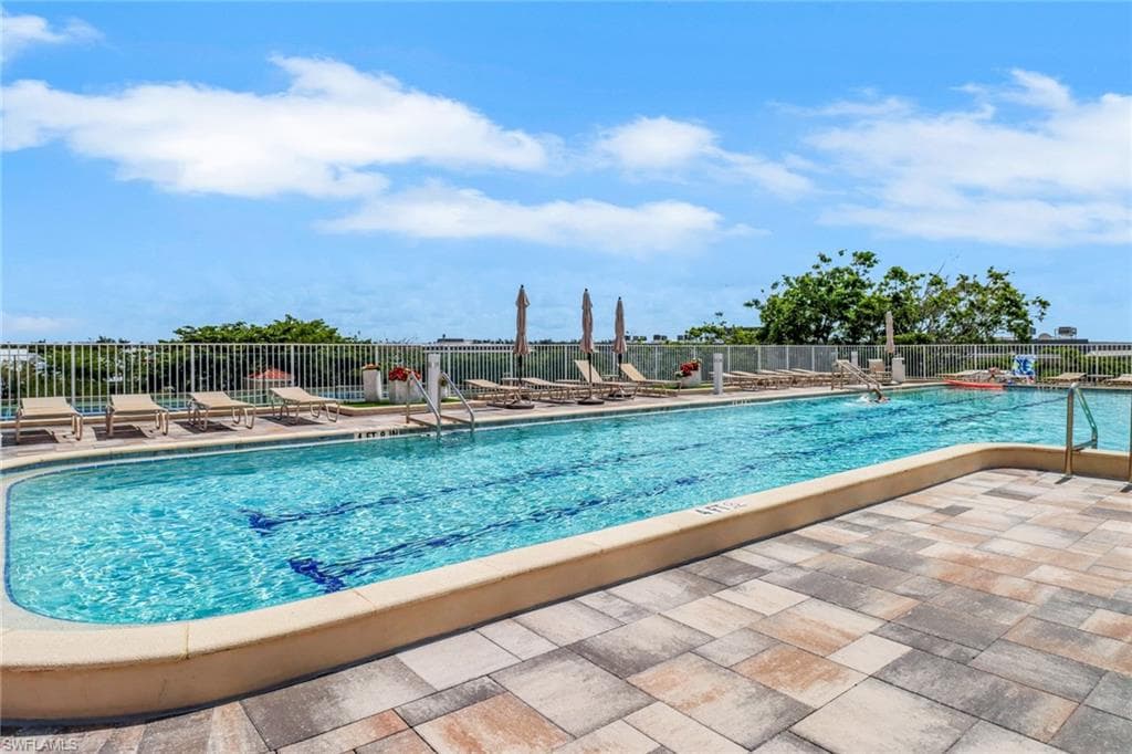Community pool with a patio area
