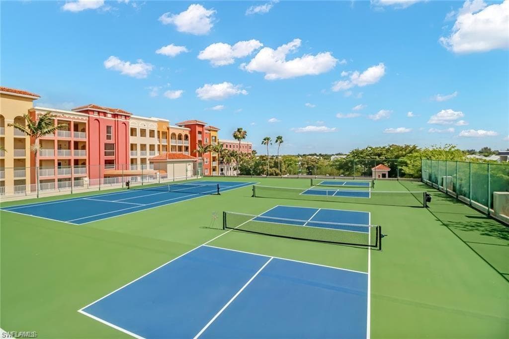 View of tennis court featuring community basketball court