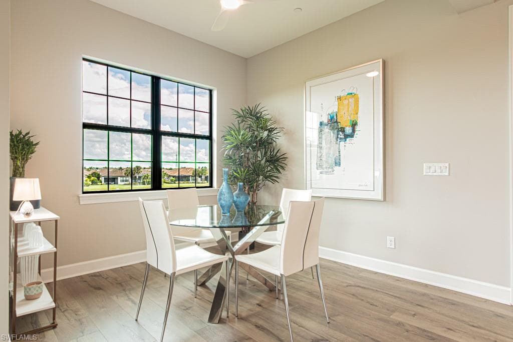 Dining room featuring wood finished floors and a ceiling fan