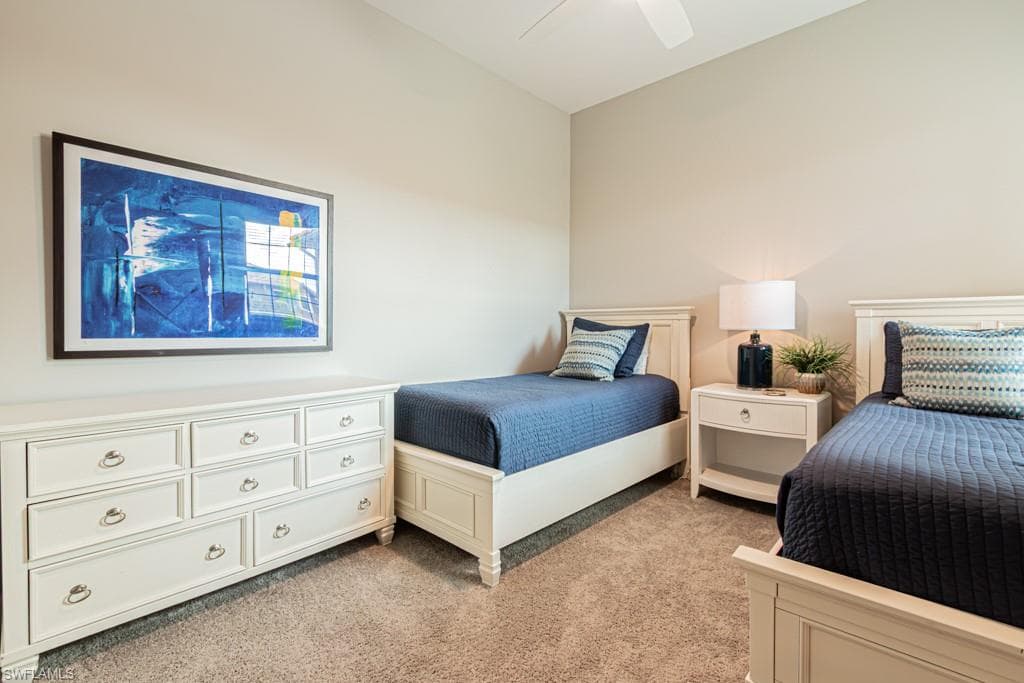 Bedroom with light carpet and ceiling fan