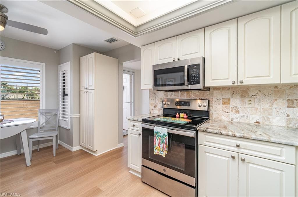 Kitchen looking towards front door and breakfast area